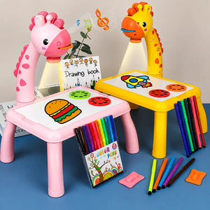 Mesinha Magic Kids em modelos rosa e amarelo com projetor, canetinhas e acessórios para desenhar